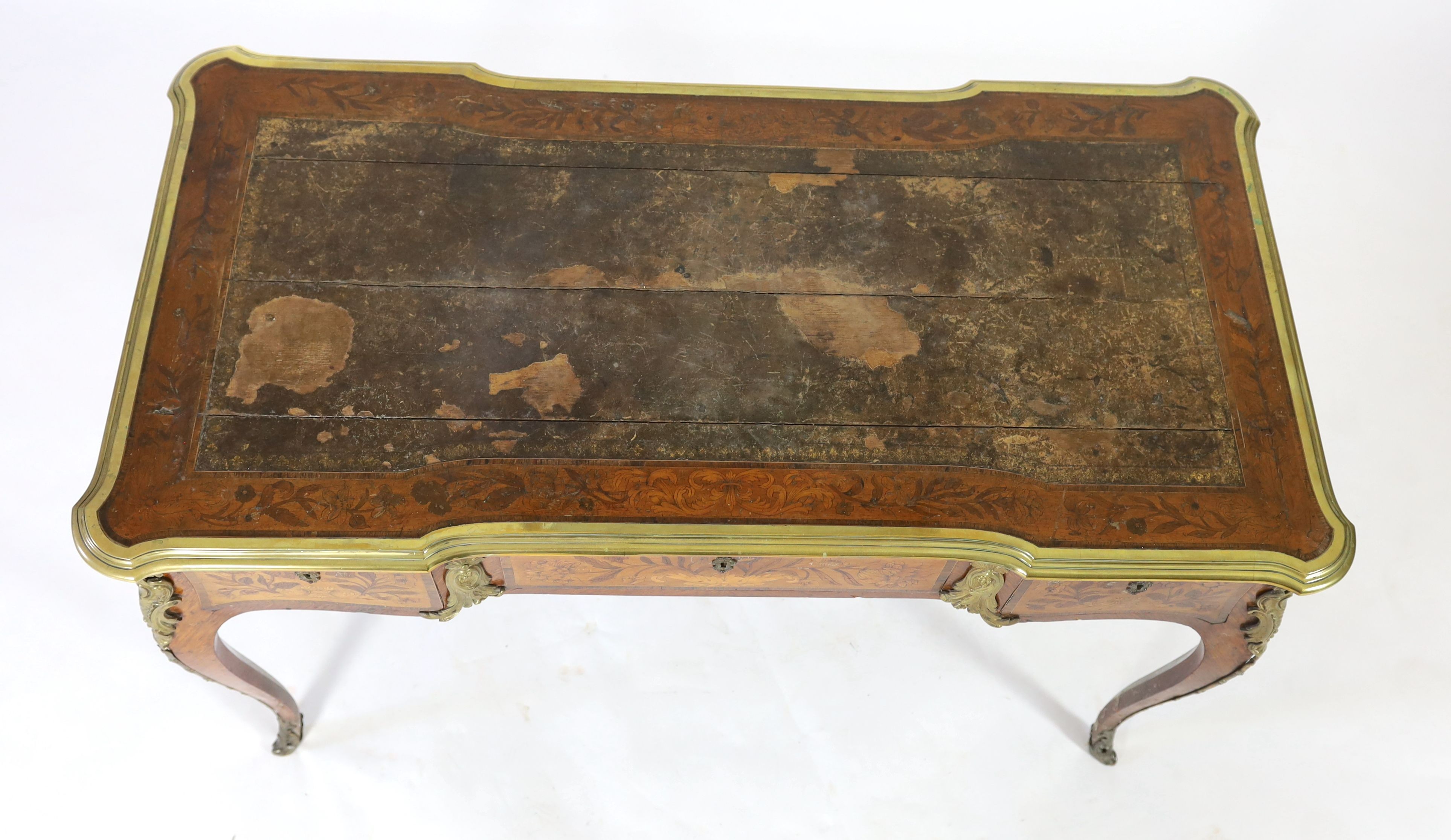 An early 20th century Louis XVI style ormolu mounted marquetry bureau plat, W.123cm D.64cm H.76cm